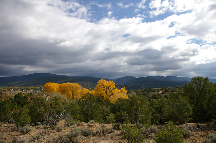 Clouds, mountains, and fall color make an impressive display in Taos, NM