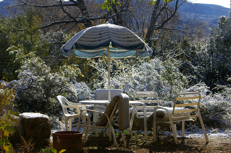 Snow on the patio table in Taos, New Mexico.