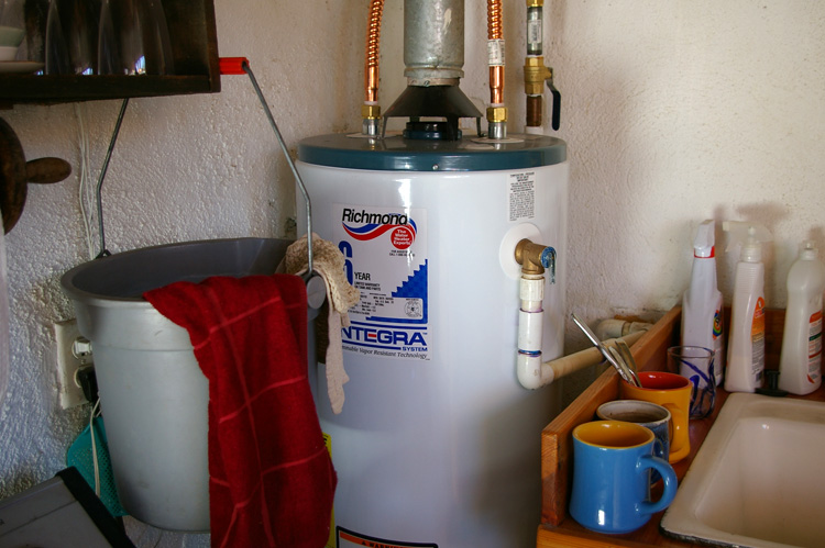 Life in an old adobe sometimes means things like a hot water heater in the kitchen.