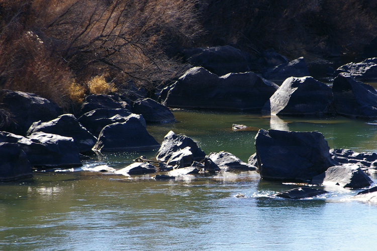 Very old rocks on the banks of the Rio Grande River near Pilar, New Mexico.