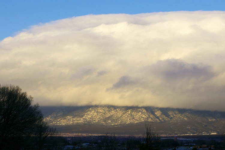 Snow clouds over Taos Mountain