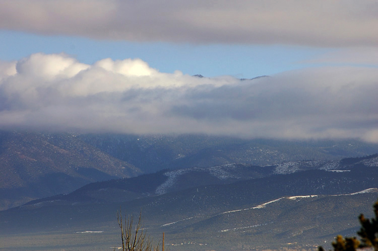 Clouds and mountains make an impressive display in Taos, NM