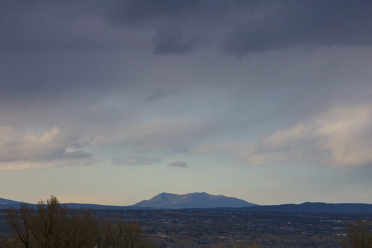 A distant mountain at sunset as seen from Taos, NM