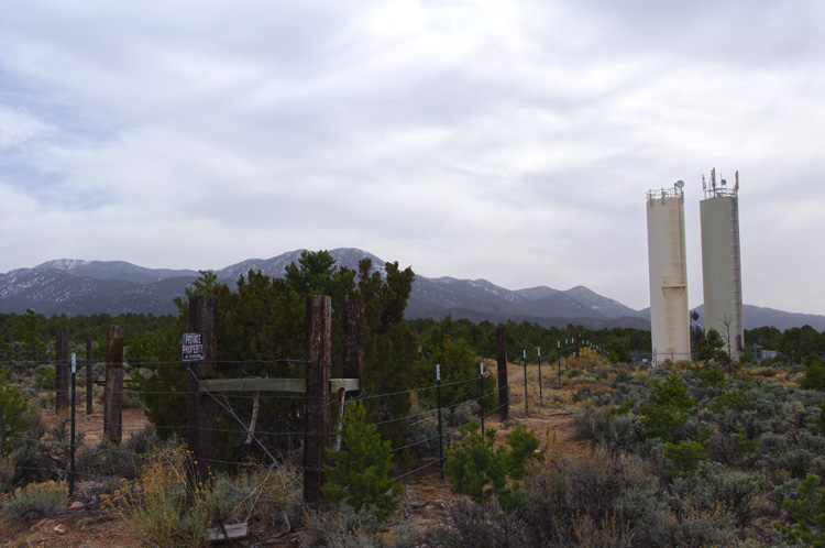 Picuris Mountains south of Taos, New Mexico (with barbed wire & water towers)