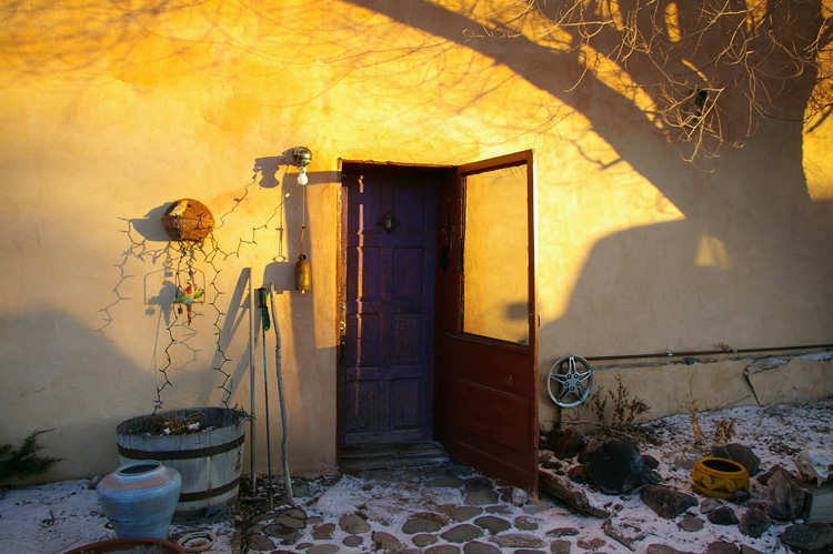 Primitive timeless grace--sunset on a door in Taos, New Mexico
