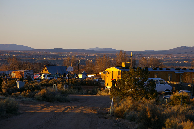 view of trailer and old cars in Taos
