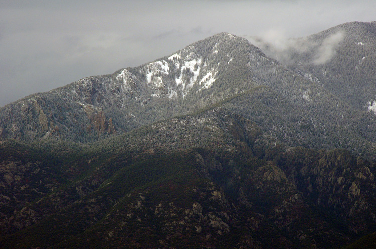 Taos Mountain in shadow and sun after a rain