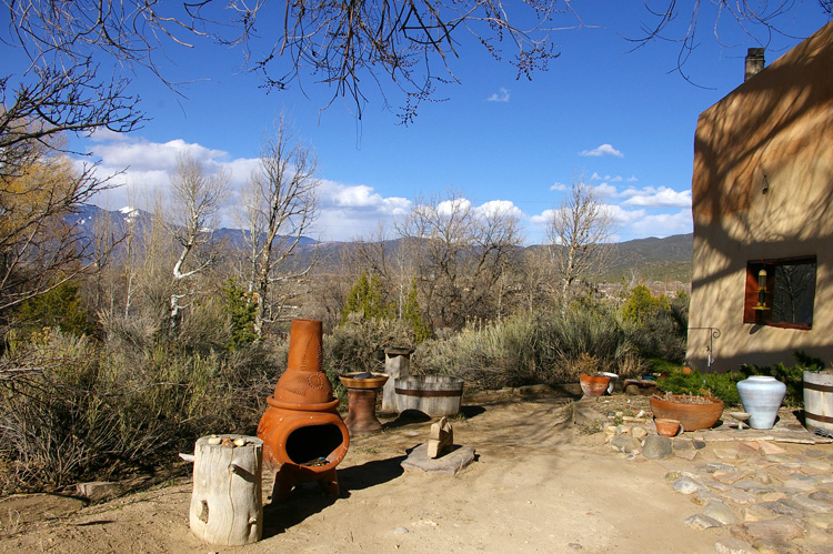 Outside the old adobe in Taos, NM, waiting for the flowers...