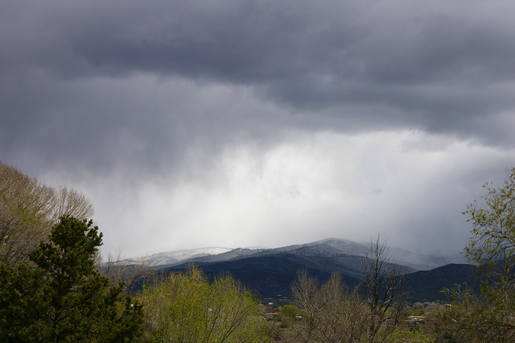 A spring snowstorm obscures the view in Taos, NM