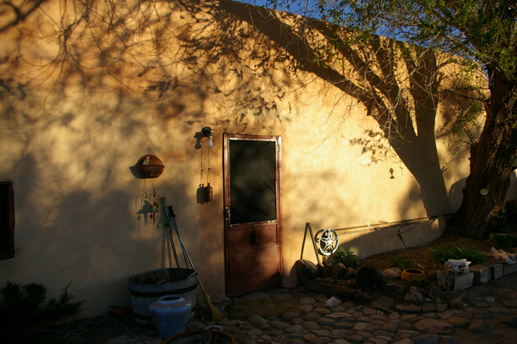 Evening shadows on an old adobe in Taos, Mexico.