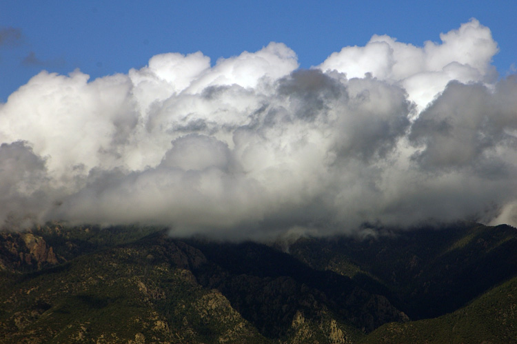 Post-storm clouds lingering over Taos Mountain