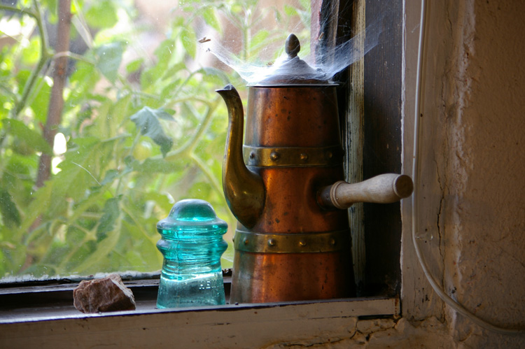 Mexican copper tea kettle with cobwebs plus old glass insulator from Maryland