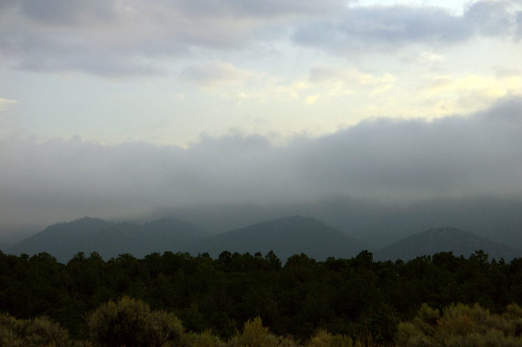 Autumn foothills in the mist south of Taos, New Mexico.