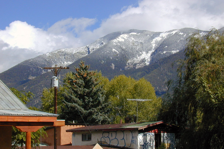 Snow on the mountains as seen from Arroyo Seco, NM in September, 2002.