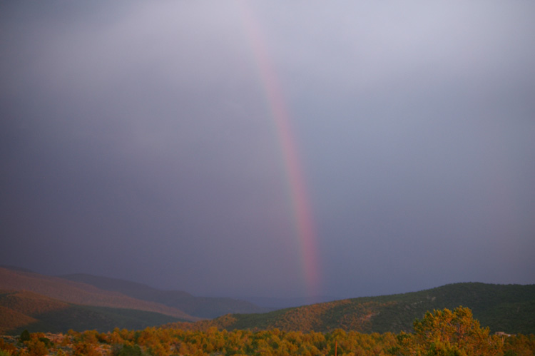 A sunset rainbow as seen from Llano Quemado.